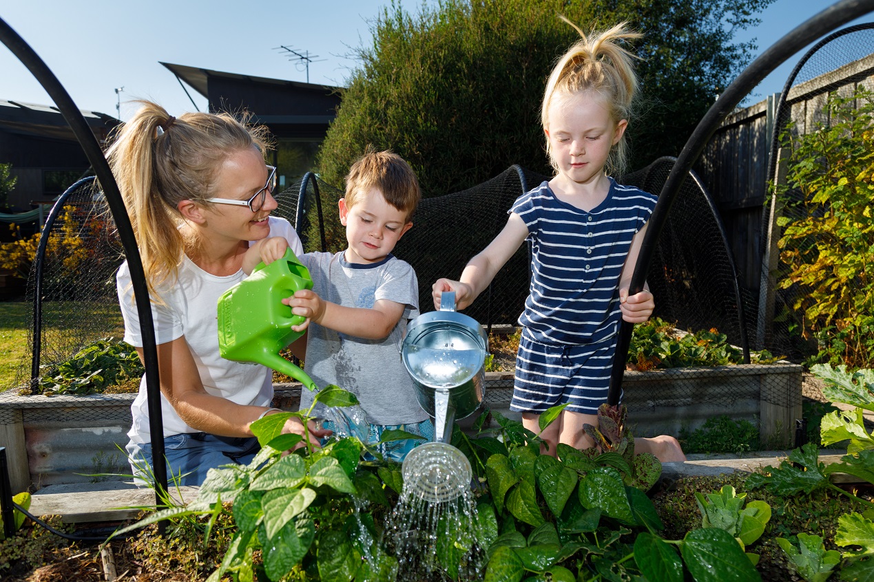 A Tasmanian family practicing being water wise in the garden 